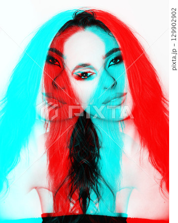 Beautiful woman with smokey makeup close up studio portrait in RGB color split effect 129902902