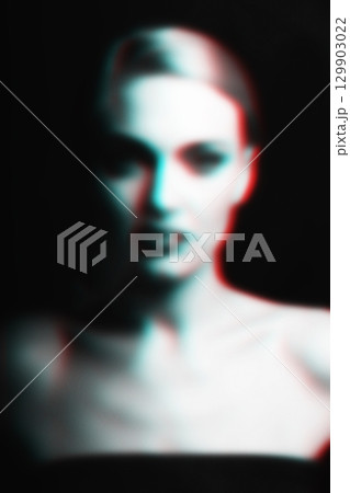 Abstract blurred and noisy woman silhouette portrait in RGB color split effect style 129903022