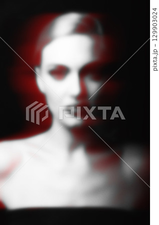 Abstract blurred and noisy woman portrait silhouette in red color split effect style 129903024