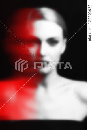 Abstract blurred and noisy woman portrait silhouette in red color split effect style 129903025
