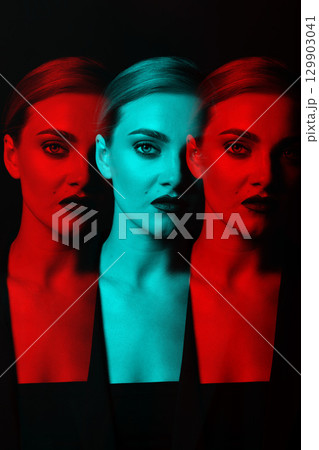 Beautiful woman with classic hairstyle and suit close-up studio portrait in RGB color split effect 129903041