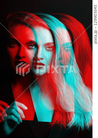 Beautiful woman with long hair close-up studio portrait in RGB color split effect Beautiful woman with long hair close-up studio portrait in RGB color split effect 129903045