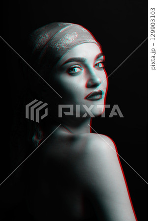 Woman with scarf on her studio portrait in RGB color split effect style Woman with scarf on her studio portrait in RGB color split effect style 129903103