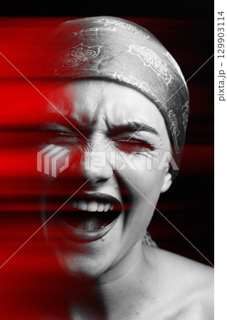 Woman with screaming facial expression and scarf on her head studio portrait in RGB color split effect Woman with screaming facial expression and scarf on her head studio portrait in RGB color split effect 129903114