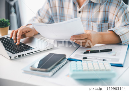 Woman calculating monthly home expenses, taxes, bank account balance and credit card bills payment, Income is not enough for expenses. financial planning, business calculate tax, investment finance. 129903144