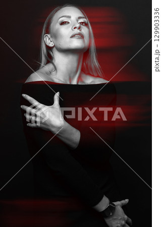 Beautiful woman with black dress studio portrait in RGB color split effect style Beautiful woman with black dress studio portrait in RGB color split effect style 129903336