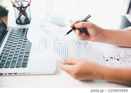 Businesswoman analysis with financial data, marketing business strategy project, Business financing accounting banking concept, finances, calculate about cost to real estate investment, tax system. Businesswoman analysis with financial data, marketing business strategy project, Business financing accounting banking concept, finances, calculate about cost to real estate investment, tax system. 129903988