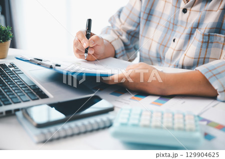 Woman calculating monthly home expenses, taxes, bank account balance and credit card bills payment, Income is not enough for expenses. financial planning, business calculate tax, investment finance. Woman calculating monthly home expenses, taxes, bank account balance and credit card bills payment, Income is not enough for expenses. financial planning, business calculate tax, investment finance. 129904625