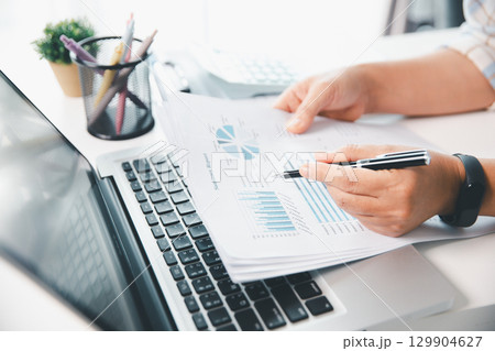 Businesswoman analysis with financial data, marketing business strategy project, Business financing accounting banking concept, finances, calculate about cost to real estate investment, tax system. 129904627
