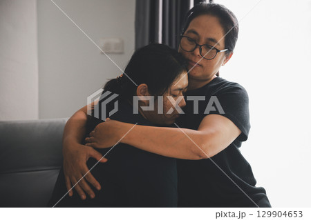 Hope and trust with crisis concept. Closeup, love and holding hands for support, comfort and care with grief, loss and empathy. people and family with compassion, sympathy and healing with bonding. 129904653