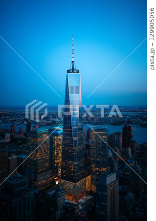 Stunning View of a Skyscraper at Sunset From a High Vantage Point in a Bustling City 129905056