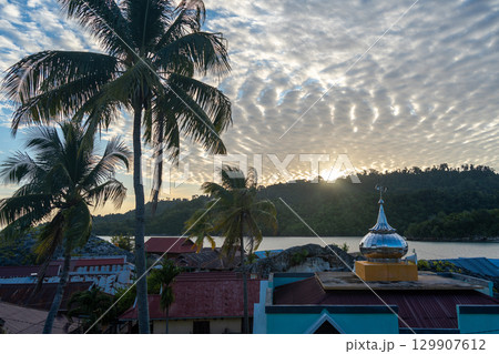 Sunset over Pulau Papan mosque and village, Malenge, Sulawesi, Indonesia Sunset over Pulau Papan mosque and village, Malenge, Sulawesi, Indonesia 129907612