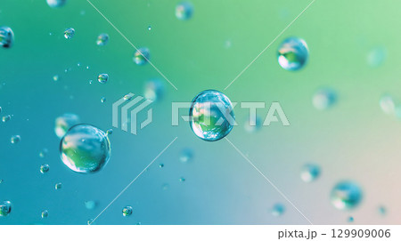 Floating water droplets blue green abstract background 129909006