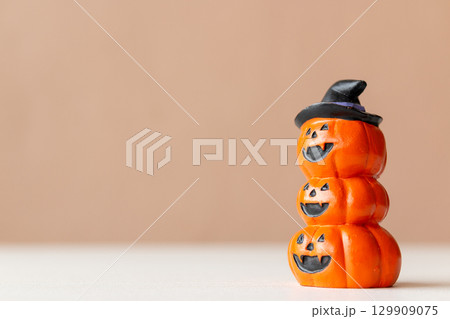Halloween Pumpkins with Carved Faces Isolated 129909075