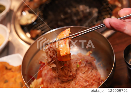 Korean noodle food. Bibim naengmyeon (cold buckwheat noodles) with Korean bbq meat Korean noodle food. Bibim naengmyeon (cold buckwheat noodles) with Korean bbq meat 129909792
