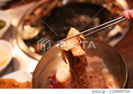 Korean noodle food. Bibim naengmyeon (cold buckwheat noodles) with Korean bbq meat 129909794