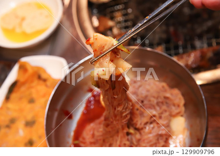 Korean noodle food. Bibim naengmyeon (cold buckwheat noodles) with Korean bbq meat 129909796