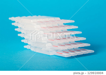 Tubes with a new generation probiotic on a blue background for the treatment of intestinal diseases. Restoration of intestinal microflora during dysbacteriosis. Tubes with a new generation probiotic on a blue background for the treatment of intestinal diseases. Restoration of intestinal microflora during dysbacteriosis. 129910004