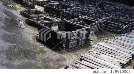 Ancient historical excavations in a museum with wooden village houses. Historical excavations, background 129910005