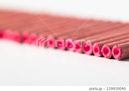 A bunch of firecrackers with red sulfur. Set of pyrotechnics, explosion hazard, macro. Copy space for text A bunch of firecrackers with red sulfur. Set of pyrotechnics, explosion hazard, macro. Copy space for text 129910040