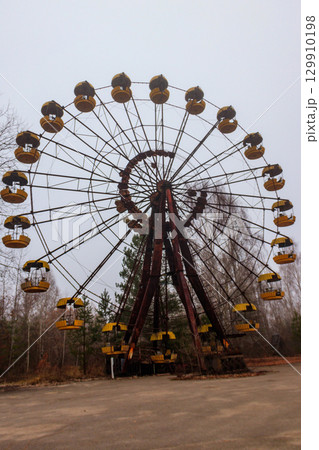 Abandoned Ferris Wheel in the amusement park of ghost town Pripyat in Chernobyl Exclusion Zone, Ukraine 129910198