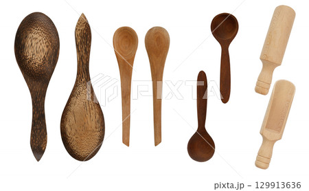 Collection of different wooden spoons, measuring scoop, spatulas, front and back top view. Isolated on white background Collection of different wooden spoons, measuring scoop, spatulas, front and back top view. Isolated on white background 129913636