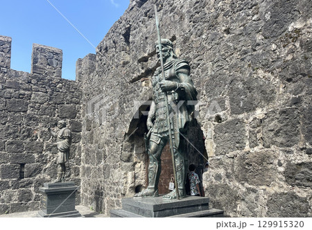 Ancient bronze figures of the Roman Emperor Hadrian and the Colchian Prince Apsyrtus near Fortress 129915320