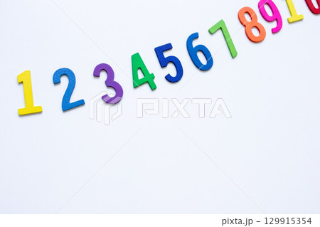 Colorful wooden numbers on white background in ascending order Colorful wooden numbers on white background in ascending order 129915354