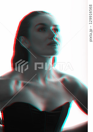 Beautiful woman with corset and wet hair studio portrait in RGB color split effect style Beautiful woman with corset and wet hair studio portrait in RGB color split effect style 129916568