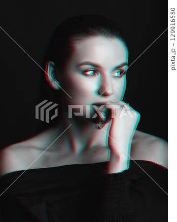 Beautiful woman with dark hair and blouse close-up studio portrait in RGB color split effect style 129916580