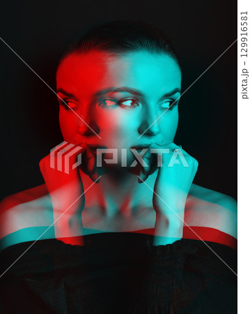 Beautiful woman with dark hair and blouse close-up studio portrait in RGB color split effect style Beautiful woman with dark hair and blouse close-up studio portrait in RGB color split effect style 129916581