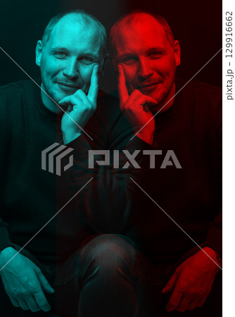 Happy man with sweatshirt studio portrait in glitch and RGB color split effect style Happy man with sweatshirt studio portrait in glitch and RGB color split effect style 129916662