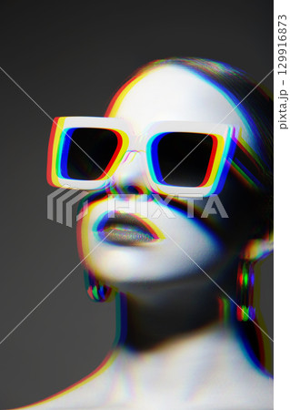 Woman portrait with classic hairstyle, big retro sunglasses and earrings in RGB color split effect style Woman portrait with classic hairstyle, big retro sunglasses and earrings in RGB color split effect style 129916873