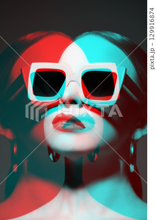 Woman portrait with classic hairstyle, big retro sunglasses and earrings in RGB color split effect style 129916874