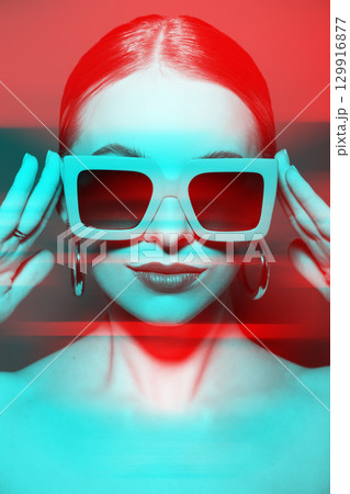Woman portrait with classic hairstyle, big retro sunglasses and earrings in RGB color split effect style Woman portrait with classic hairstyle, big retro sunglasses and earrings in RGB color split effect style 129916877