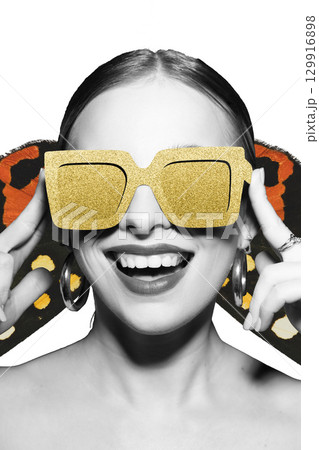 Woman portrait with classic hairstyle and golden retro sunglasses 129916898