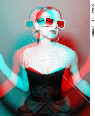 Beautiful woman studio portrait with big retro sunglasses and black corset in RGB channel color split effect style 129916909