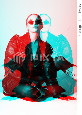 Woman studio portrait with black punk leather jacket, sunglasses and without bra in RGB color split effect style Woman studio portrait with black punk leather jacket, sunglasses and without bra in RGB color split effect style 129916935