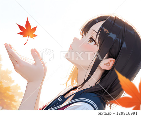 セーラー服の女子高生と秋の季節感あふれる青春と紅葉の通学シーン 129916991