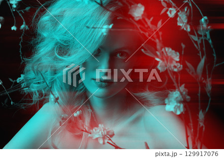 Beautiful woman with big wavy hair and flowers black and white studio portrait in RGB color split effect style 129917076