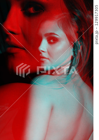 Beautiful woman with naked back and palm leaf studio portrait in RGB color split effect style Beautiful woman with naked back and palm leaf studio portrait in RGB color split effect style 129917305