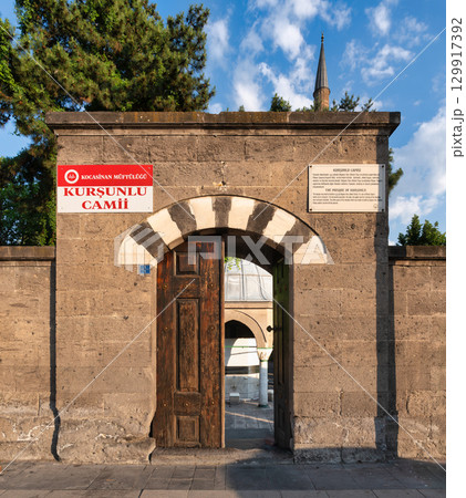 Arched stone entrance and wooden gate of Kursunlu Mosque, or Kursunlu Camii, Kayseri, Turkey 129917392