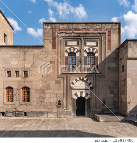 Gevher Nesibe Madrasa, or Kayseri Ethnography Museum, in Kayseri, Turkey. Historic Seljuk architecture with ornate windows and arched entrance Gevher Nesibe Madrasa, or Kayseri Ethnography Museum, in Kayseri, Turkey. Historic Seljuk architecture with ornate windows and arched entrance 129917406
