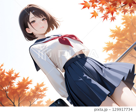 セーラー服の女子高生と秋の季節感あふれる青春と紅葉の通学シーン 129917734
