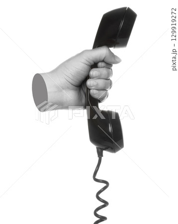 Hand holds classic telephone handset, isolated on transparent background, retro technology concept. Contemporary art Hand holds classic telephone handset, isolated on transparent background, retro technology concept. Contemporary art 129919272