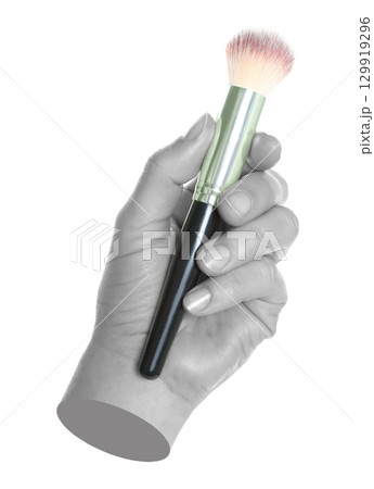Woman hand holds black cosmetics brush, isolated on transparent background, cosmetics and visage concept. Contemporary art 129919296
