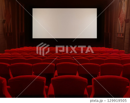 A classic movie theater with red velvet seats and a widescreen screen creates an immersive movie-watching experience. 129919505
