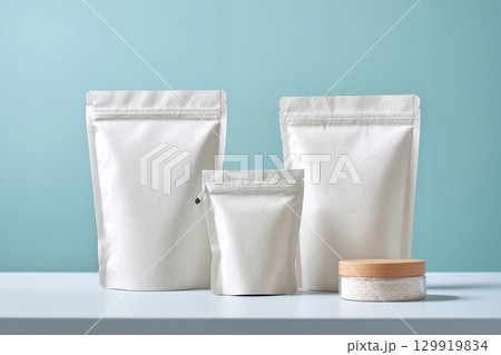 white cosmetic pouch bag on white wooden shelf 129919834