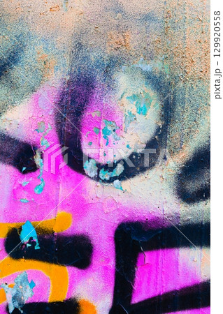 Vibrant Graffiti Texture in Neon Pink, Blue, Yellow with 80s Urban Flair Vibrant Graffiti Texture in Neon Pink, Blue, Yellow with 80s Urban Flair 129920558