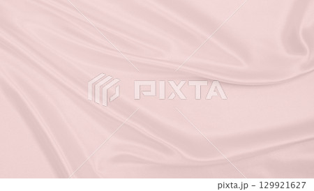 Smooth elegant pink silk or satin texture as wedding background. Luxurious background design 129921627
